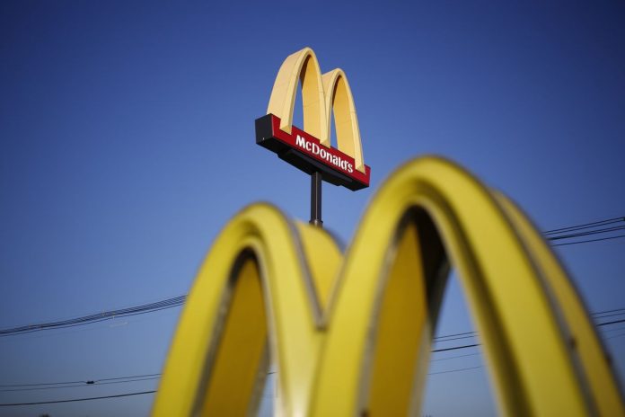 Signage is displayed outside a McDonald's