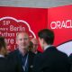 logo of Oracle Corp. sits on the software company's stand at the Connecticum job fair for students, graduates and young professionals at Tempelhof airport in Berlin