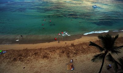 Tourists enjoy at the Waikiki beach vacation in Honolulu, Hawai.