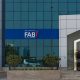 First Abu Dhabi (FAB) Bank blue close up storefront sign and entrance.